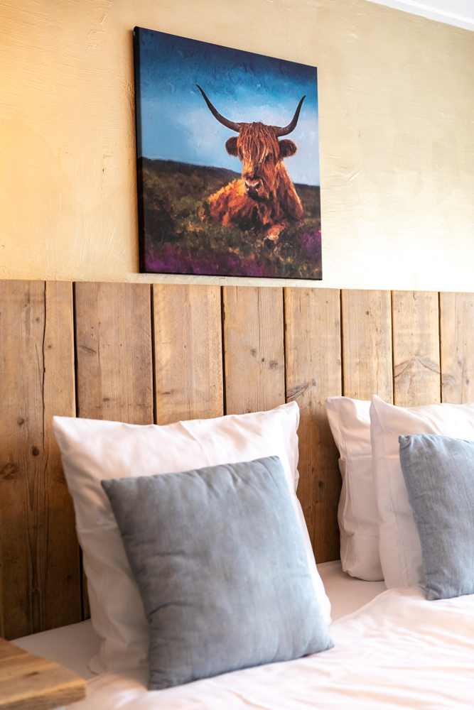 Bed van de koestalkamer bij Grenzeloos